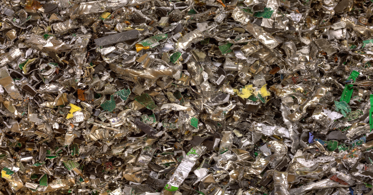 A pile of metal scraps that have amassed from the remains of shredded hard drives for data security purposes.