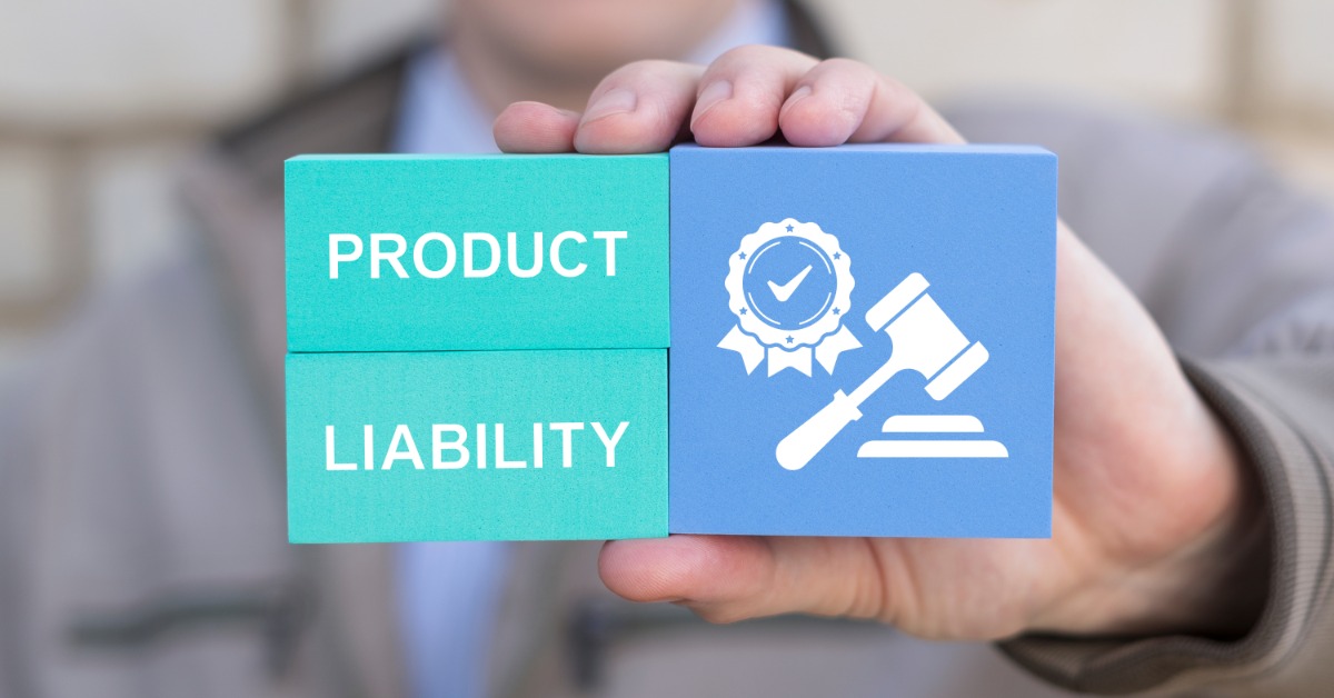 A person holding out three cubes. Two cubes read "Product Liability" while the third shows a gavel and certificate.