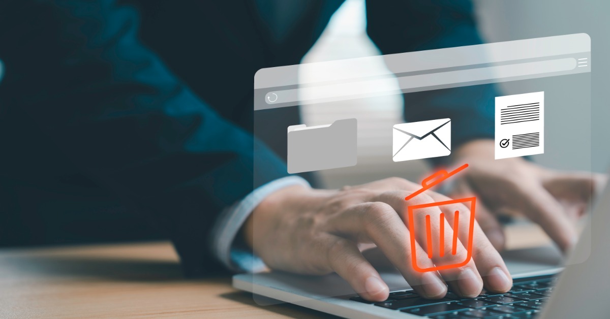 Graphics icons over a laptop show an envelope, a folder, and a document over a red-orange trash can symbol.